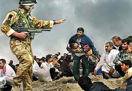 Photo of a British soldier towering over Iraqi civilians.