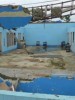 What caused the 6-month delay in the release of funding for repair of schools destroyed by Typhoon Haiyan?